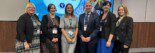 Group of workshop presenters from Youth Employment UK, Harlow College and Milton Keyenes College in front of screen at AoC Conference.